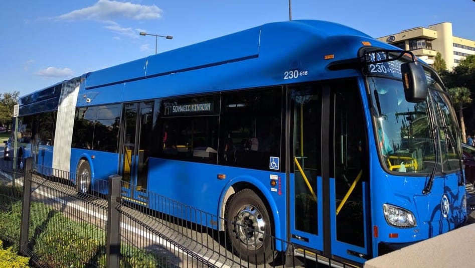 Orlando's Lynx blue bus going down the street